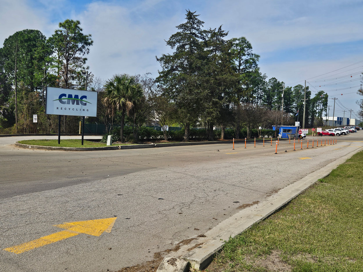 Exterior photo from the road showing the main entrance sign to CMC Recycling.